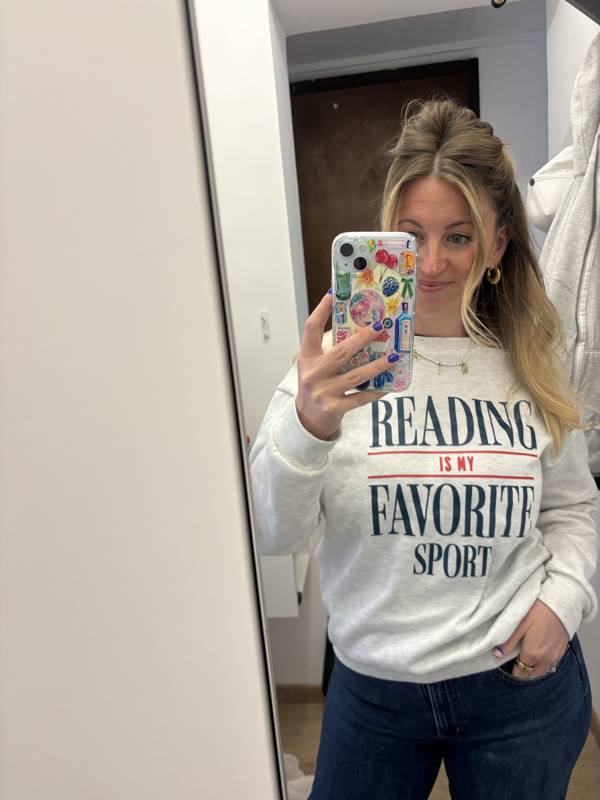 Jenn in a Reading Is My Favorite Sport sweatshirt